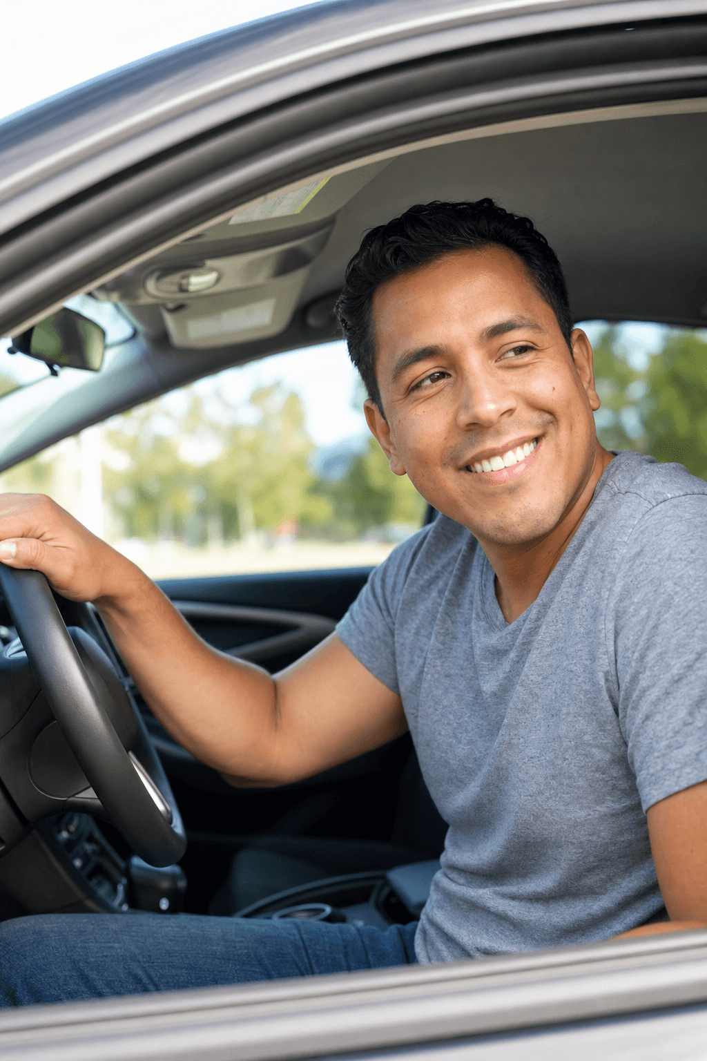 Surf Thru Express customer smiling in their freshly washed car